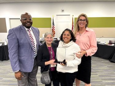 Jennifer Adair holding OSBA award